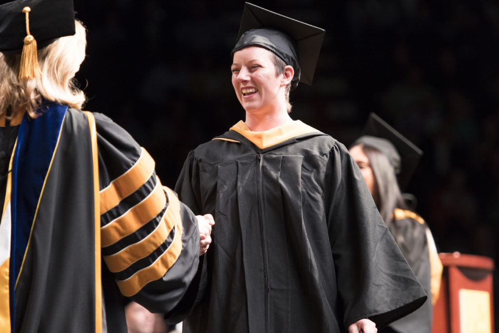 Crystal Plowinske receives her degree at Commencement in 2018.